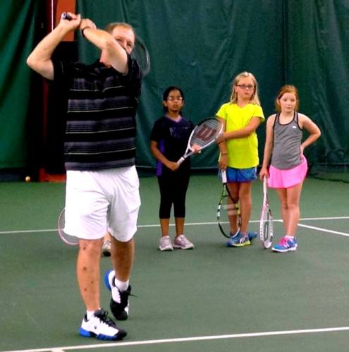 Des demonstrates the backhand follow-through