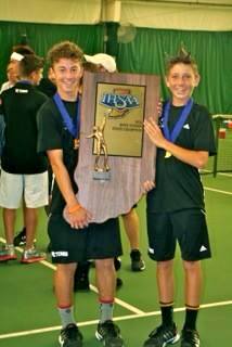 Indiana State Champions JJ Kroot and JT Wynne proudly hold the IHSAA Trophy
