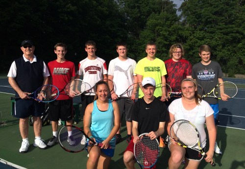 The high school group enjoying playing in great weather outdoors 