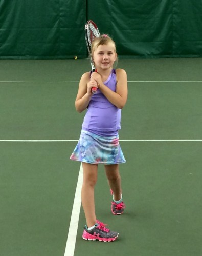 Meredith holds her backhand follow through