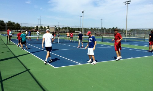 The boys tennis team working on their conditioning at New Palestine